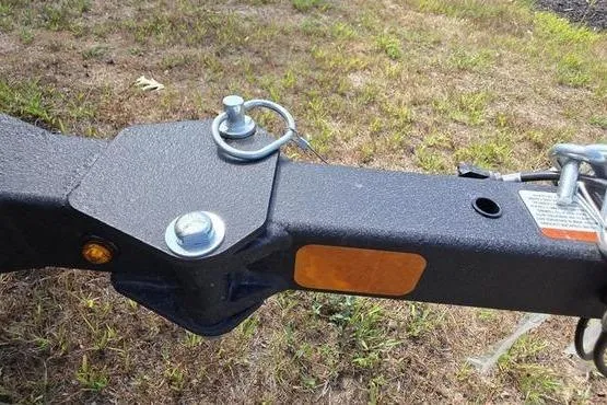 Slide: The Image of Trailer hitch of 2026 Tracker Pro 170 on grassy ground. - 10