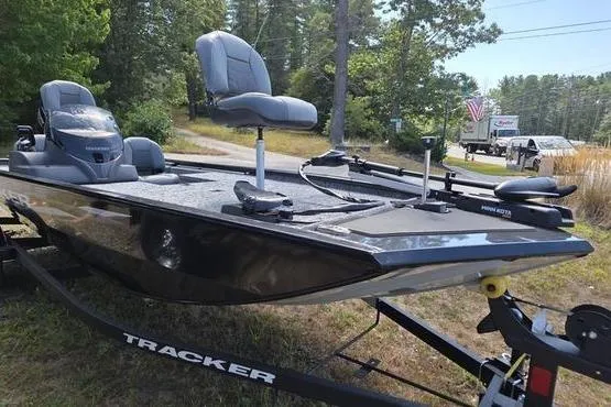 Slide: The Image of 2026 Tracker Pro 170 fishing boat on trailer, parked outdoors. - 11