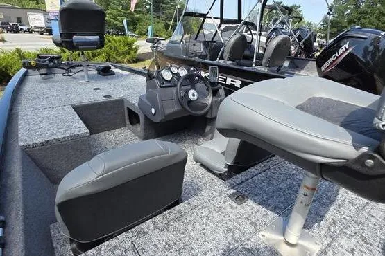 Slide: The Image of 2026 Tracker Pro 170 boat interior with steering wheel and seating, featuring modern design. - 2