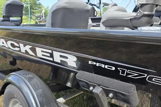 Slide: The Image of 2026 Tracker Pro 170 boat, black exterior, close-up view, parked on trailer. - 3