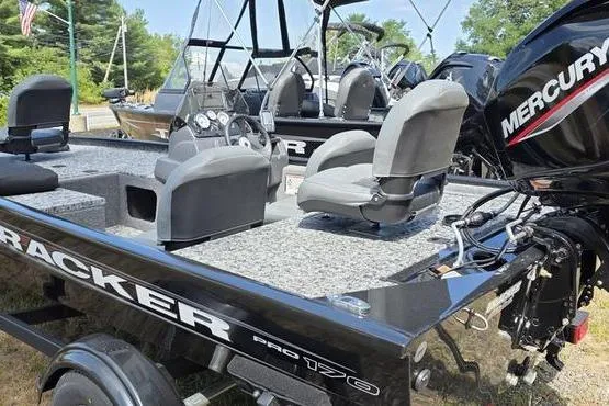 Slide: The Image of 2026 Tracker Pro 170 boat with Mercury engine, featuring spacious seating and modern design. - 4