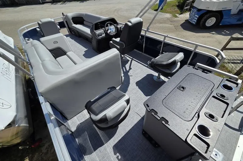 Slide: The Image of 2026 Sun Tracker SF 20 DLX pontoon boat interior with seating and helm. - 15