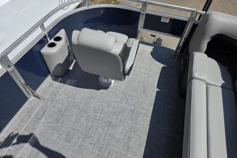 Slide: The Image of 2026 Sun Tracker SF 20 DLX pontoon boat interior with gray seating and flooring. - 3
