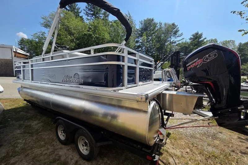 Slide: The Image of 2026 Sun Tracker SF 20 DLX pontoon boat on trailer with Mercury outboard motor. - 9