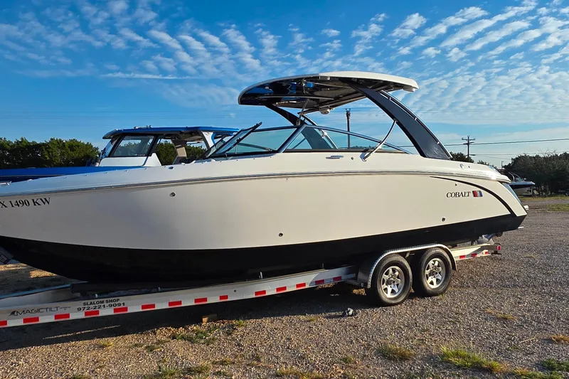Slide: The Image of 2023 Cobalt R30 boat on trailer under blue sky. - 14