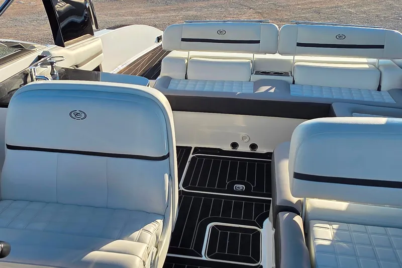 Slide: The Image of 2023 Cobalt R30 boat interior with luxurious white seating and sleek black flooring. - 30