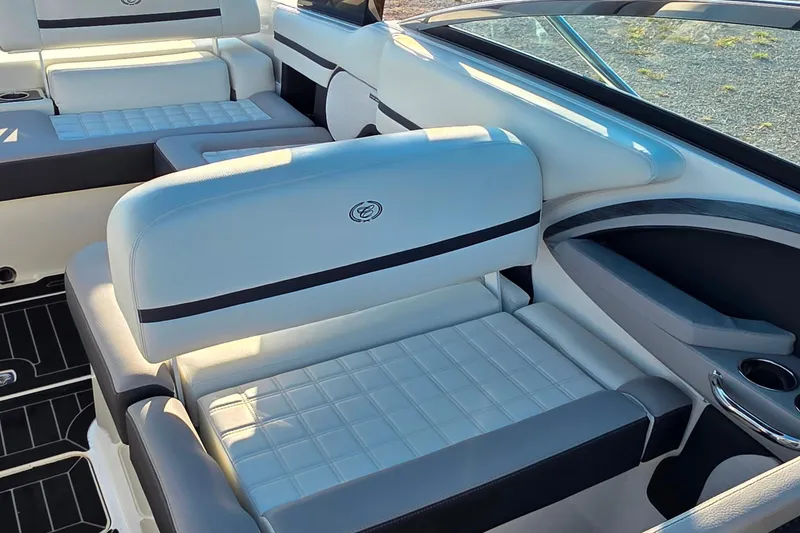 Slide: The Image of 2023 Cobalt R30 boat interior with luxurious white seating and sleek design. - 31