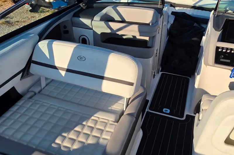 Slide: The Image of 2023 Cobalt R30 boat interior with luxurious white seating and modern design. - 32