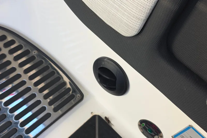 Slide: The Image of 2023 Cobalt R30 boat interior detail with vent and metal grate. - 34