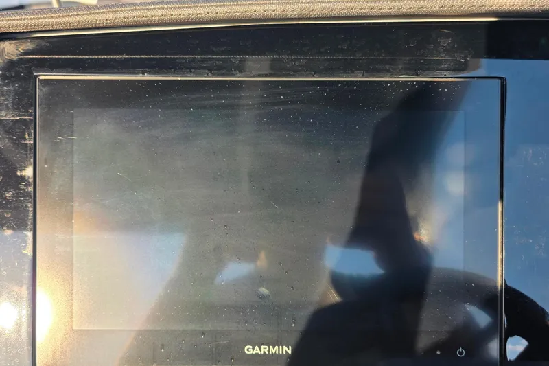 Slide: The Image of 2023 Cobalt R30 Garmin display screen with reflections and sunlight glare. - 37