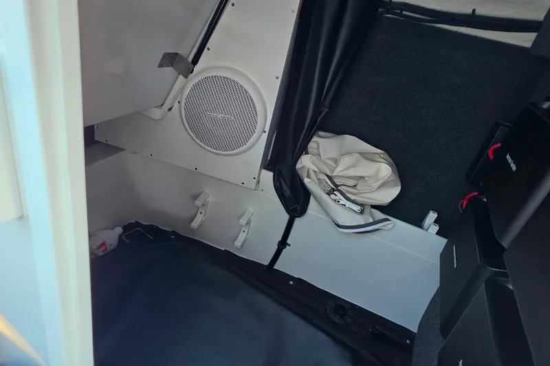 Slide: The Image of Interior of 2023 Cobalt R30 boat with speaker and storage area. - 42