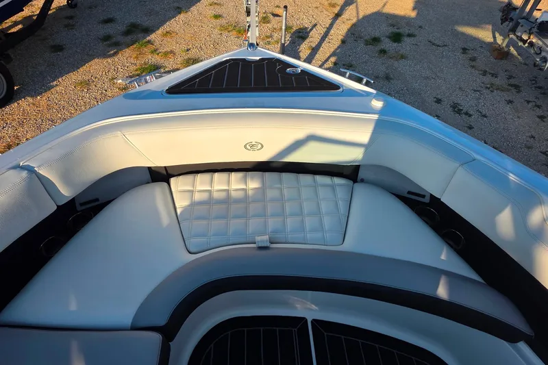 Slide: The Image of Luxurious seating area on 2023 Cobalt R30 boat, featuring elegant white upholstery. - 45