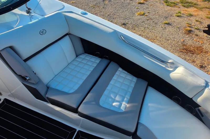 Slide: The Image of 2023 Cobalt R30 boat interior with luxurious white and gray seating. - 46