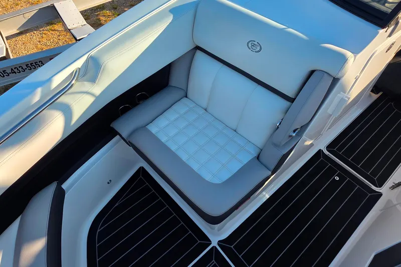 Slide: The Image of 2023 Cobalt R30 boat interior with white and gray seating, elegant design. - 47