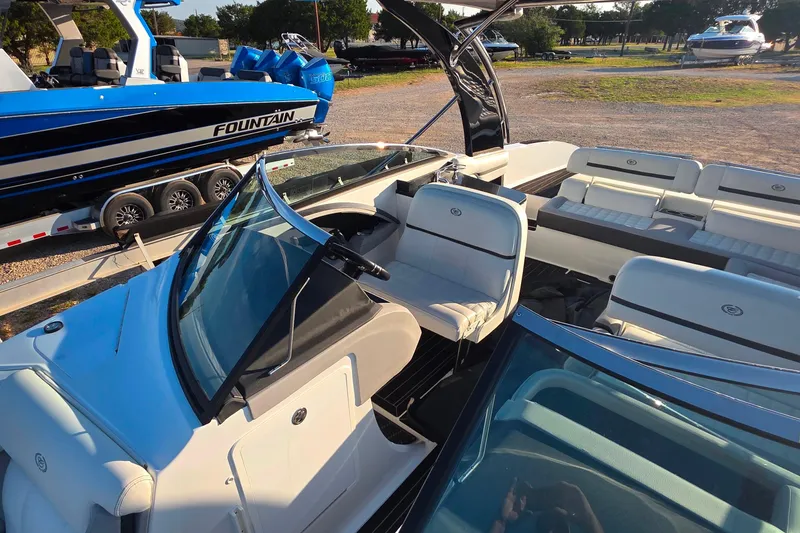 Slide: The Image of 2023 Cobalt R30 boat interior with white seating and sleek design. - 49