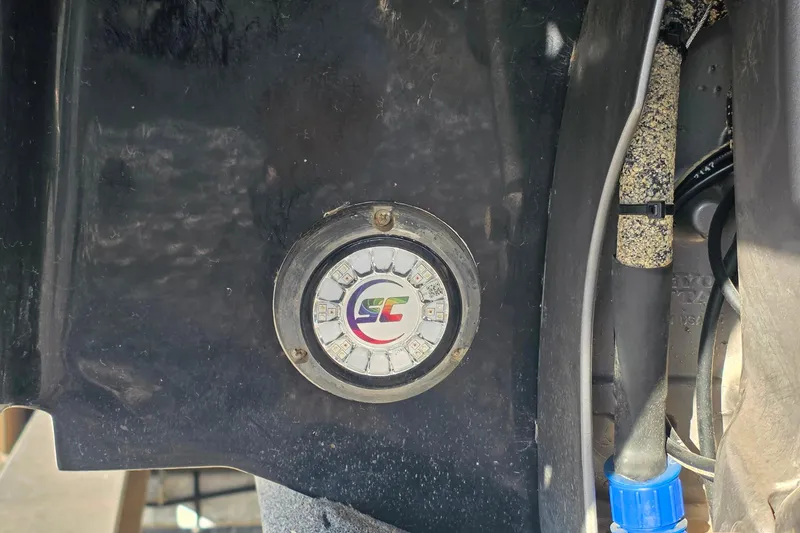 Slide: The Image of 2023 Cobalt R30 boat component with circular LED light and wiring detail. - 56