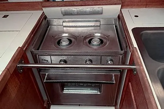 Slide: The Image of 1985 Sabre 36 yacht kitchen with stainless steel stove and oven. - 17