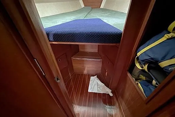 Slide: The Image of 1985 Sabre 36 sailboat cabin with wooden interior and V-berth. - 18