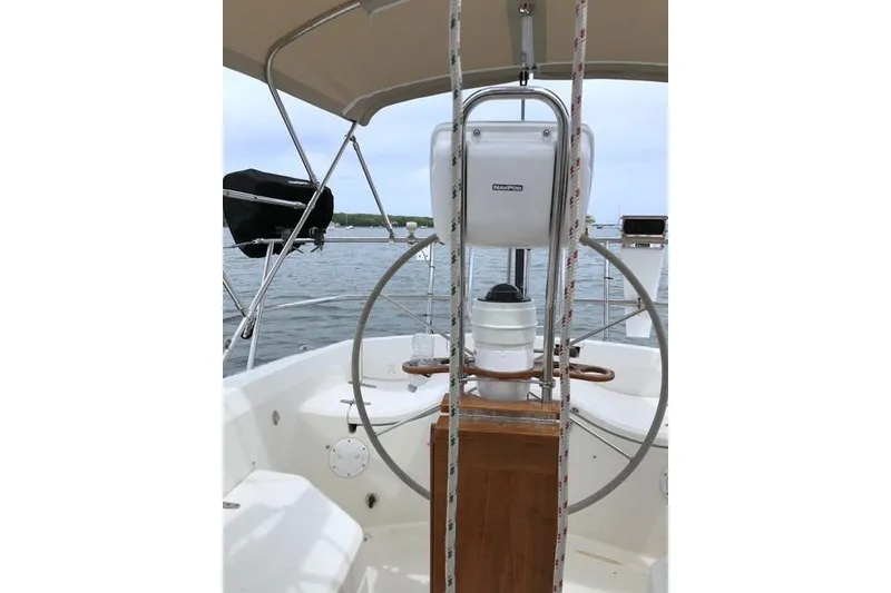 Slide: The Image of Cockpit of 1985 Sabre 36 sailboat with steering wheel and navigation equipment. - 4