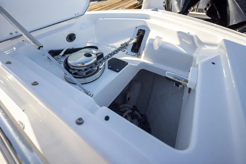 Slide: The Image of 2021 Blackfin 252DC boat anchor compartment with chain and storage space. - 25