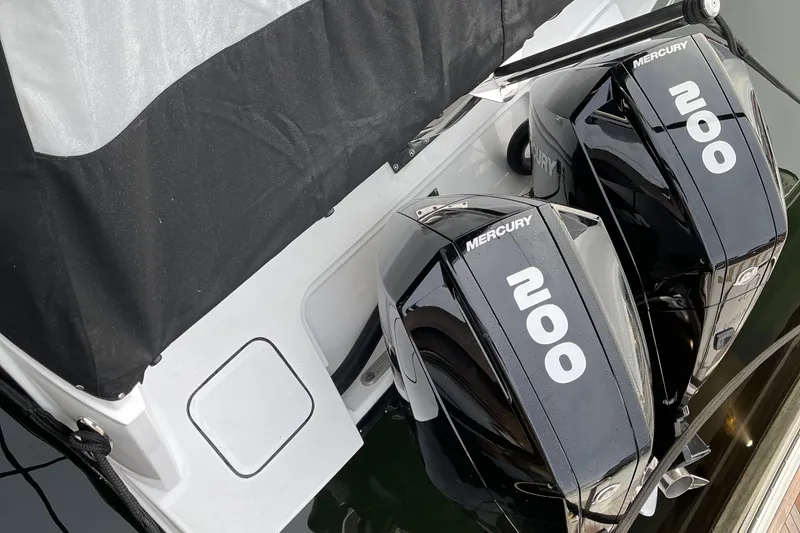 Slide: The Image of 2021 Blackfin 252DC boat with twin Mercury 200 outboard engines. - 32
