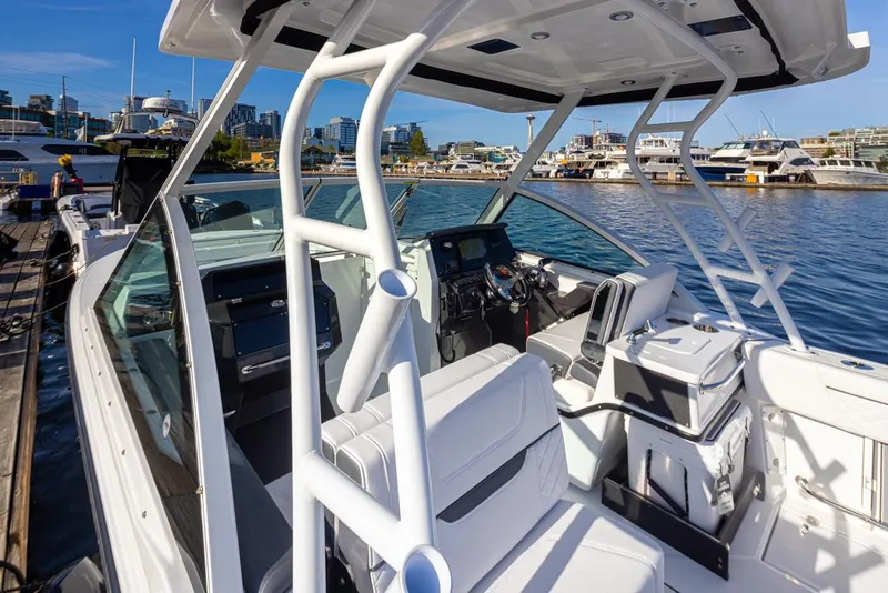 Slide: The Image of 2021 Blackfin 252DC boat docked at marina, showcasing sleek design and modern features. - 5