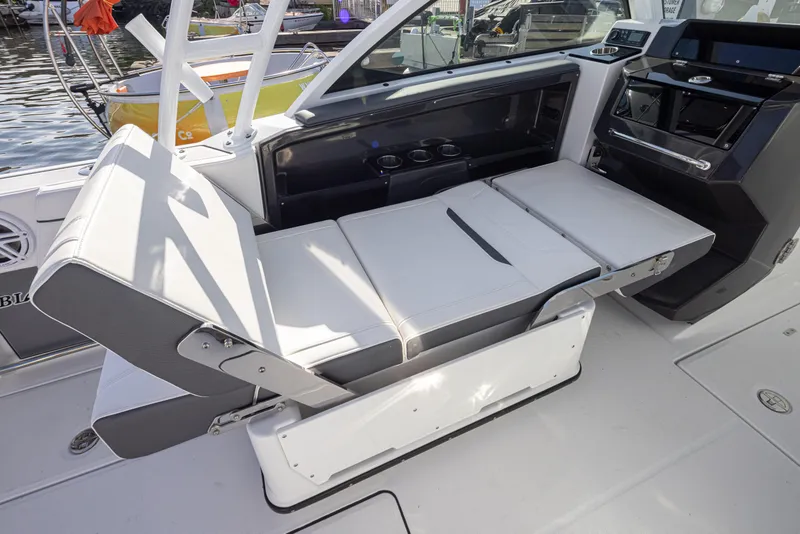 Slide: The Image of 2021 Blackfin 252DC boat interior with adjustable seating and modern dashboard. - 6