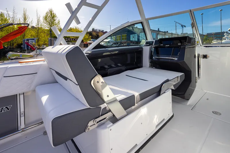Slide: The Image of 2021 Blackfin 252DC boat interior with adjustable seating and modern dashboard. - 7