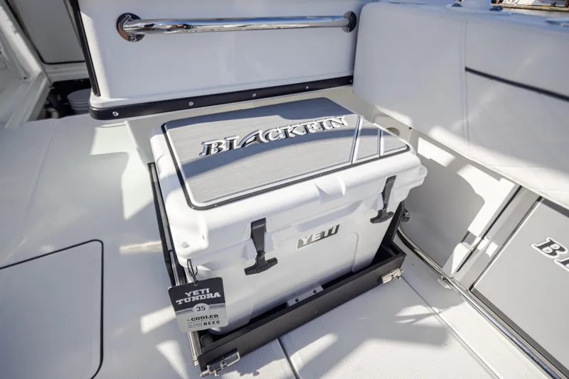 Slide: The Image of 2021 Blackfin 252DC boat with Yeti cooler on deck. - 8