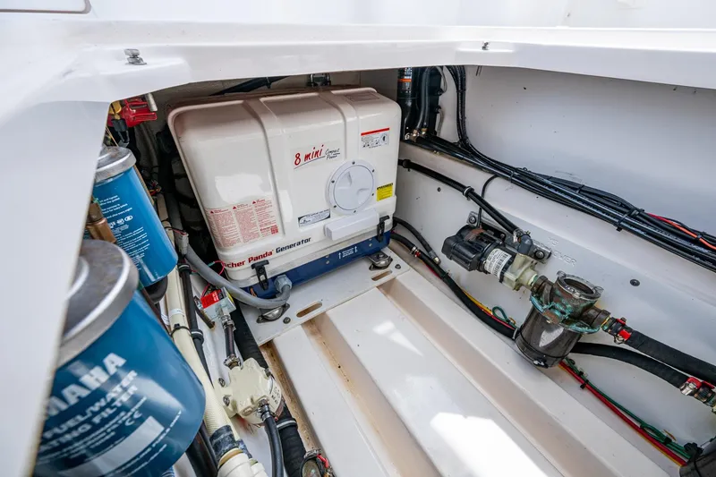 Slide: The Image of Boat engine compartment with Fischer Panda generator and Yamaha fuel filters. - 25