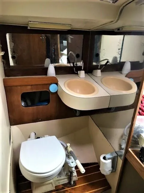 Slide: The Image of 1979 J Boats J 30 yacht bathroom with dual sinks and toilet. - 7