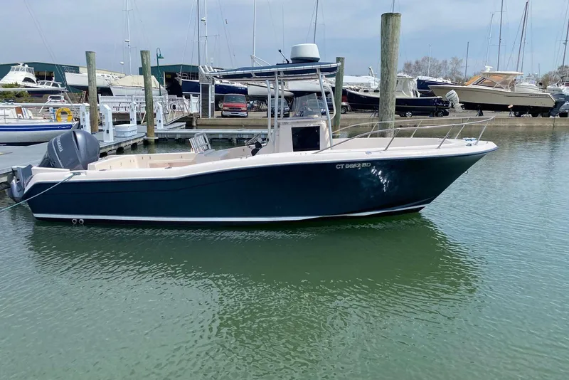 Slide: The Image of 2001 Grady-White Advance 247 boat docked in marina, side view. - 2