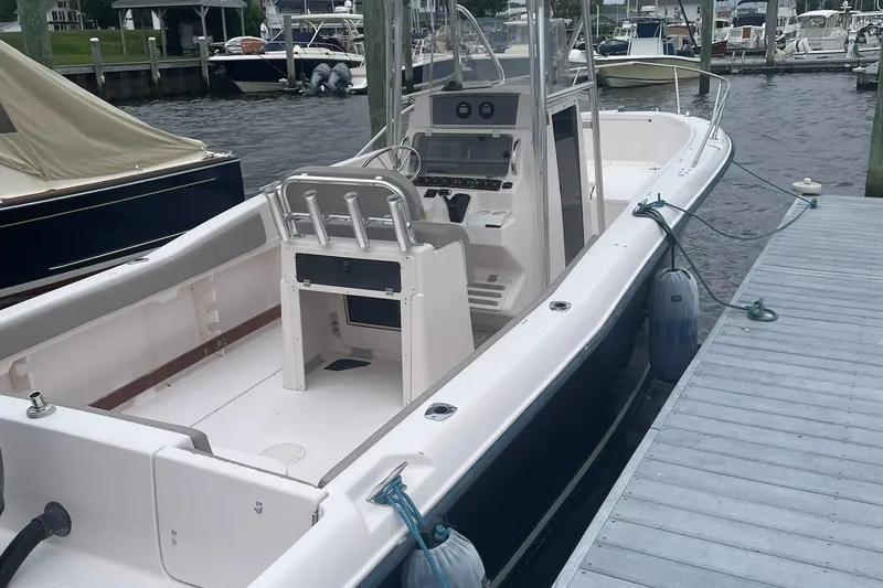 Slide: The Image of 2001 Grady-White Advance 247 boat docked at marina, side view. - 3