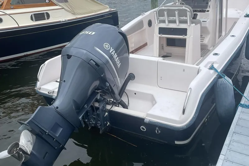 Slide: The Image of 2001 Grady-White Advance 247 boat with Yamaha 250 outboard motor docked. - 4