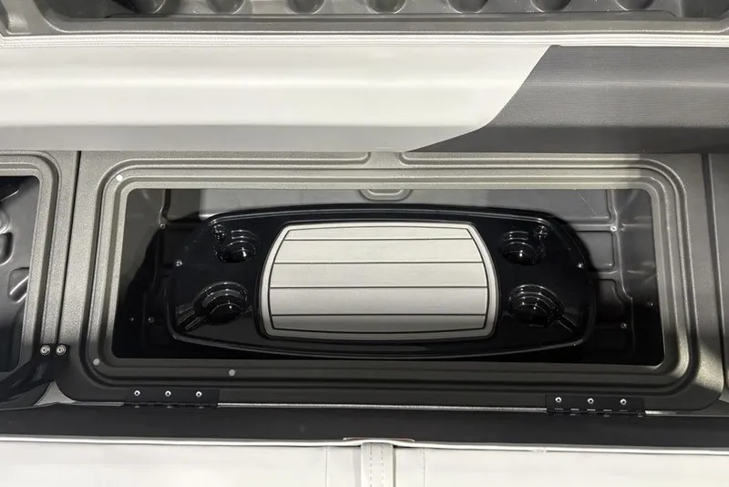 Slide: The Image of 2026 Sun Tracker PARTY BARGE® 20 DLX storage compartment with cup holders and tray. - 11