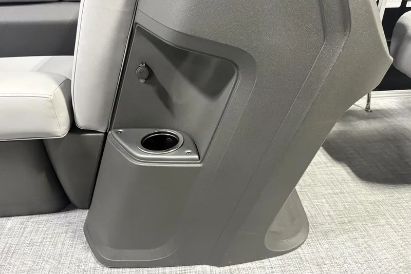 Slide: The Image of 2026 Sun Tracker PARTY BARGE® 20 DLX interior with cup holder and seating detail. - 16