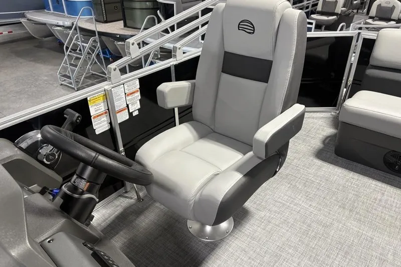 Slide: The Image of Captain's chair on 2026 Sun Tracker PARTY BARGE® 20 DLX pontoon boat, featuring sleek design. - 23