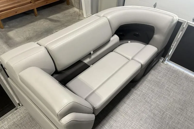 Slide: The Image of 2026 Sun Tracker PARTY BARGE® 20 DLX interior seating with plush gray upholstery. - 7