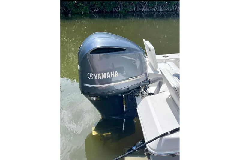 Slide: The Image of Yamaha outboard motor on 2008 Everglades 243 Center Console boat in water. - 8