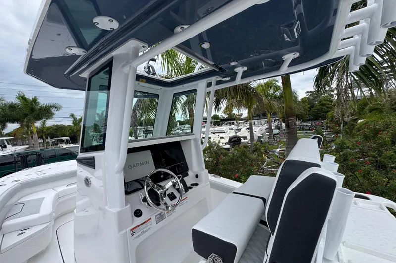 Slide: The Image of 2026 Blackfin 262 HB boat interior with Garmin navigation, sleek design, and comfortable seating. - 14
