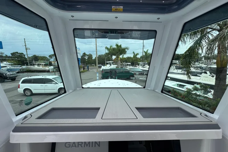 Slide: The Image of Interior view of 2026 Blackfin 262 HB boat with large windows and modern dashboard. - 19