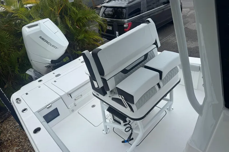Slide: The Image of 2026 Blackfin 262 HB boat with Mercury engine, featuring sleek seating and modern design. - 31