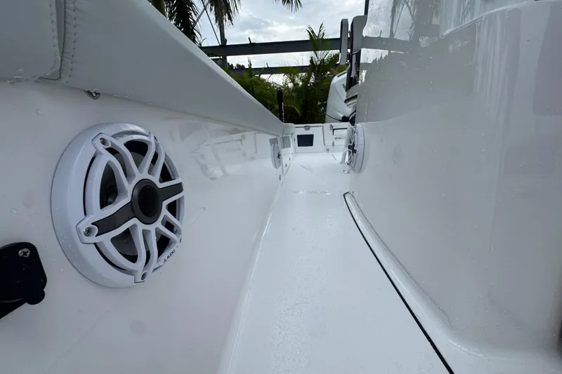 Slide: The Image of 2026 Blackfin 262 HB boat deck with speakers, sleek white design, and modern features. - 35