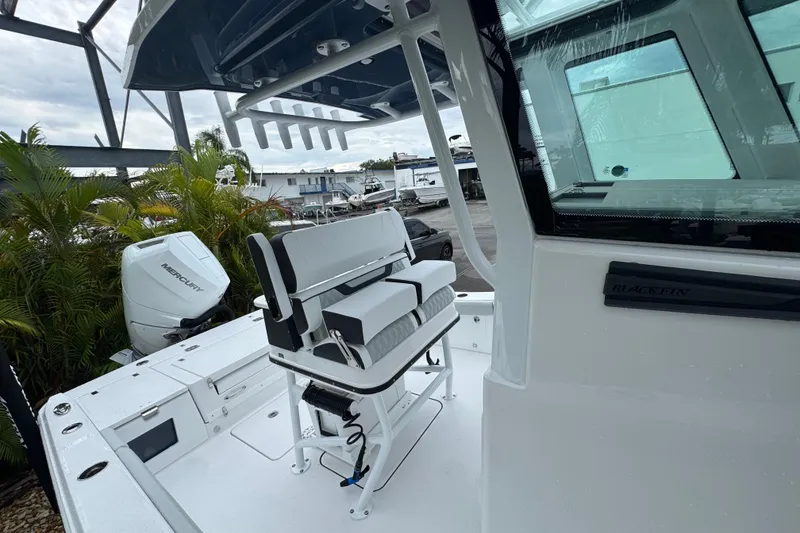 Slide: The Image of 2026 Blackfin 262 HB boat interior with seating and Mercury engine. - 36