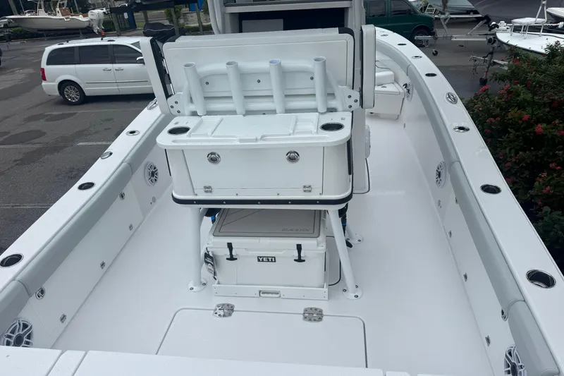 Slide: The Image of 2026 Blackfin 262 HB boat interior with fishing rod holders and Yeti cooler. - 8