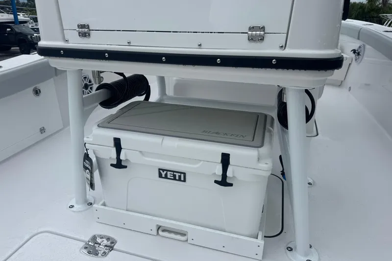 Slide: The Image of 2026 Blackfin 262 HB boat with Yeti cooler under console. - 9
