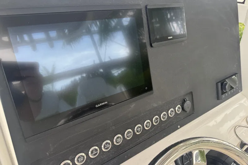 Slide: The Image of Dashboard of 2026 Key West 239 FS boat with Garmin and Yamaha displays. - 17