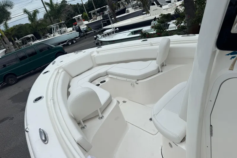 Slide: The Image of 2026 Key West 239 FS boat interior with white seating and spacious deck. - 20