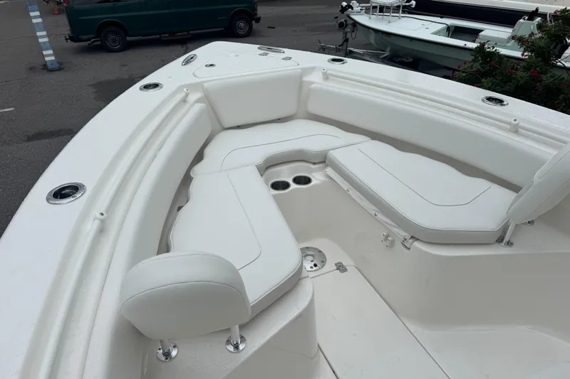 Slide: The Image of 2026 Key West 239 FS boat with spacious white seating area and cup holders. - 21