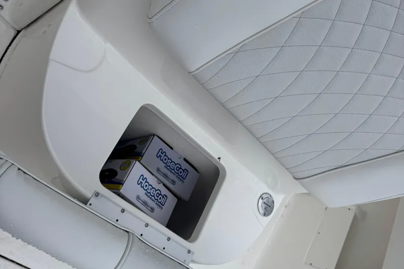 Slide: The Image of Storage compartment on 2026 Key West 239 FS boat with HoseCoil boxes inside. - 27